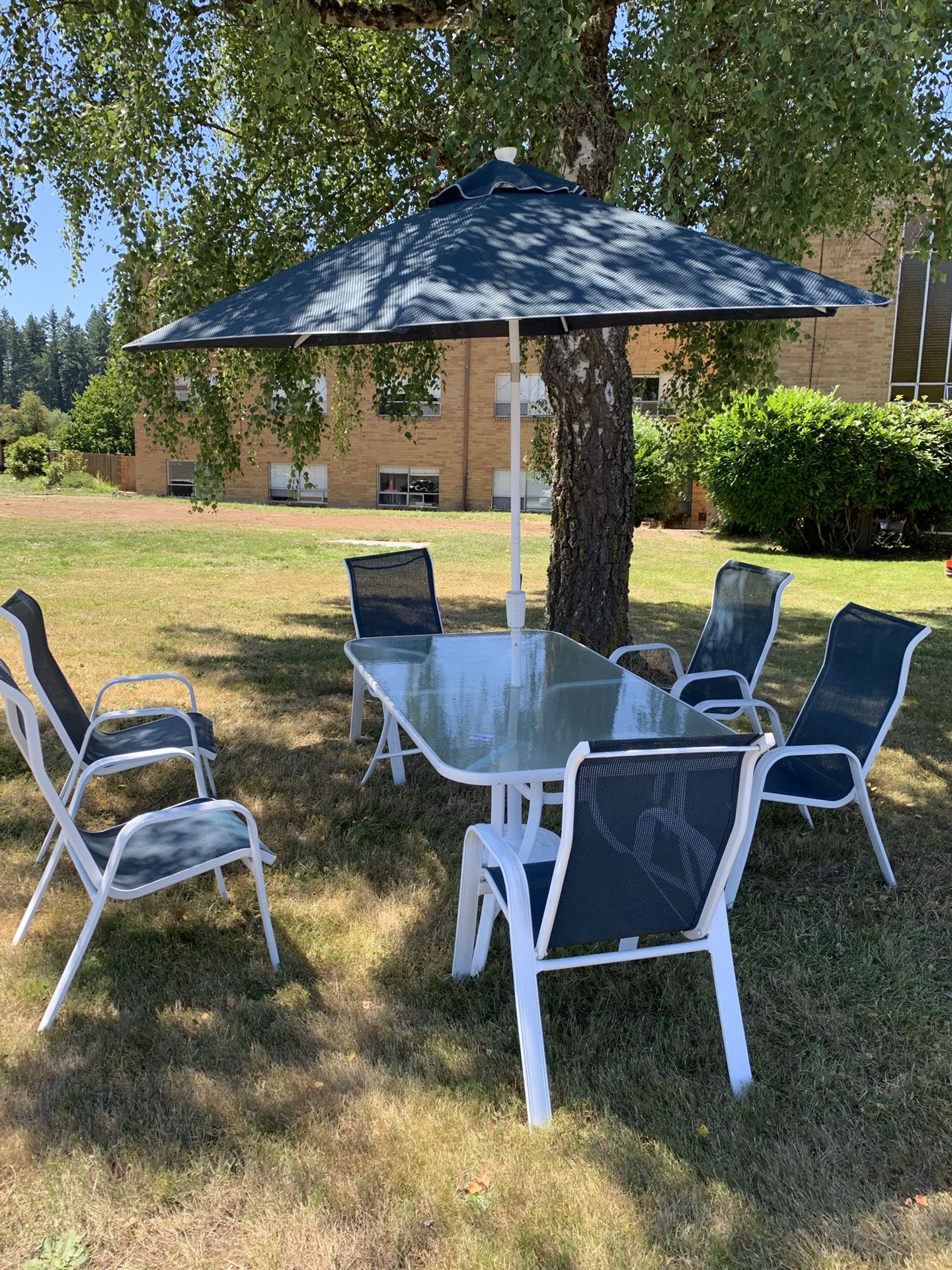Glass Patio Table w/umbrella and 6 chairs