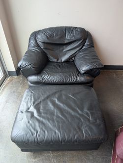 Plush Black Leather Armchair and Ottoman Set