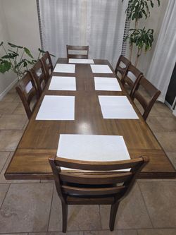 Wood Dining Table with 8 Chairs and brown living room