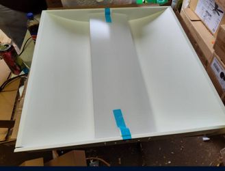 Lot of 2 metalux 2x2 led ceiling light fixtures, new but 1 has slight bend in frame as shown ($20 for both together)