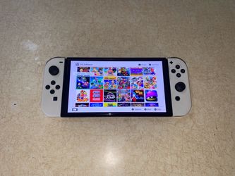 NINTENDO SWITCH OLED MOD + 125 SWITCH GAMES and 7500 CLASSIC GAMES