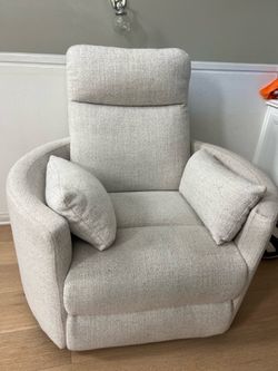 Light Gray Upholstered Recliner Chair with Matching Pillows