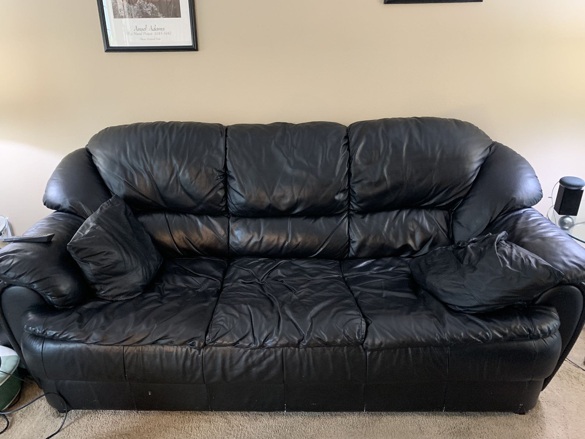 Black leather couch, chair, and ottoman 