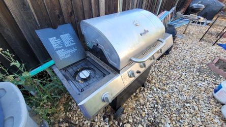 Char-Broil Propane Gas Grill With 4 Burners, 1 Push-to-start electric ignition, 1 Side Burner, and a Cover $150