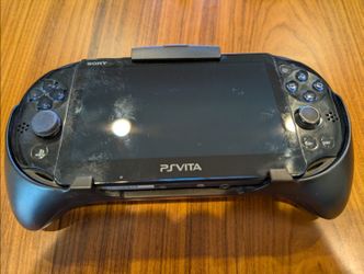 PS Vita Slim (PCH-2000) + HORI PSV-143 Remote Play Grip — bundle deal.