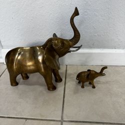 Two Vintage Brass Elephant .  the measurements of the By large one are. 12” Long and 13” High. 