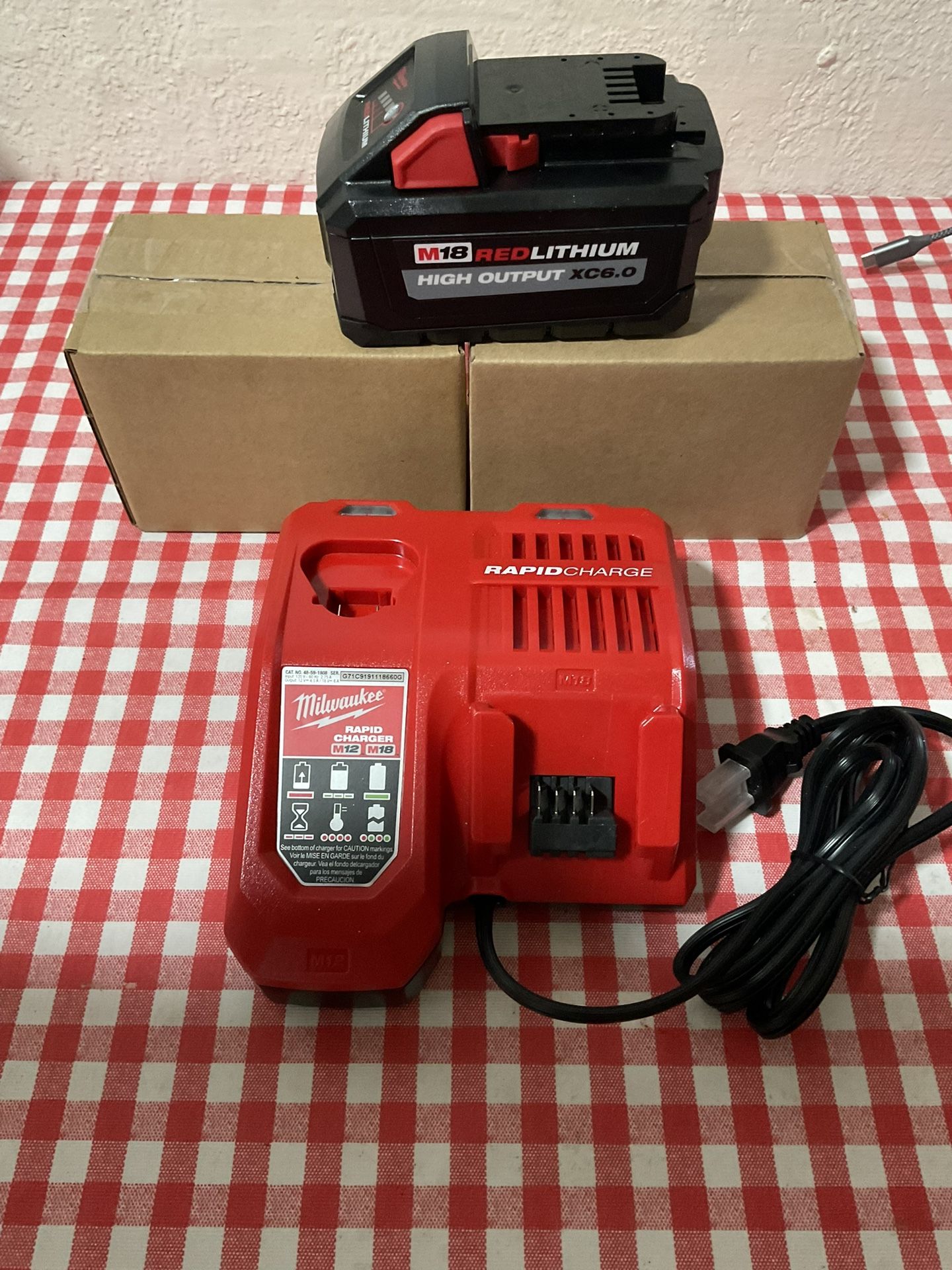 Milwaukee. M12/M18 Lithium Ion Rapid Charger and (3) High Output 6.0Ah Battery.