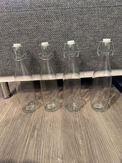Set of 4 Clear Glass Swing Top Bottles
