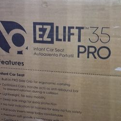 Brand New Car Seat And Tub Of Baby Boy Clothes