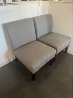 Pair of gray armless chairs