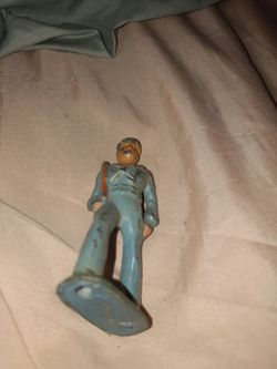 Vintage navy metal figure shows wear