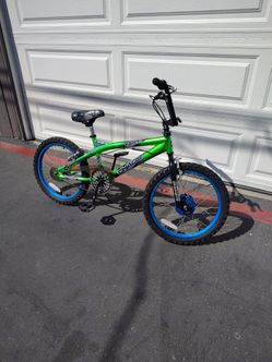 Bmx bike with knobby tires blue rims