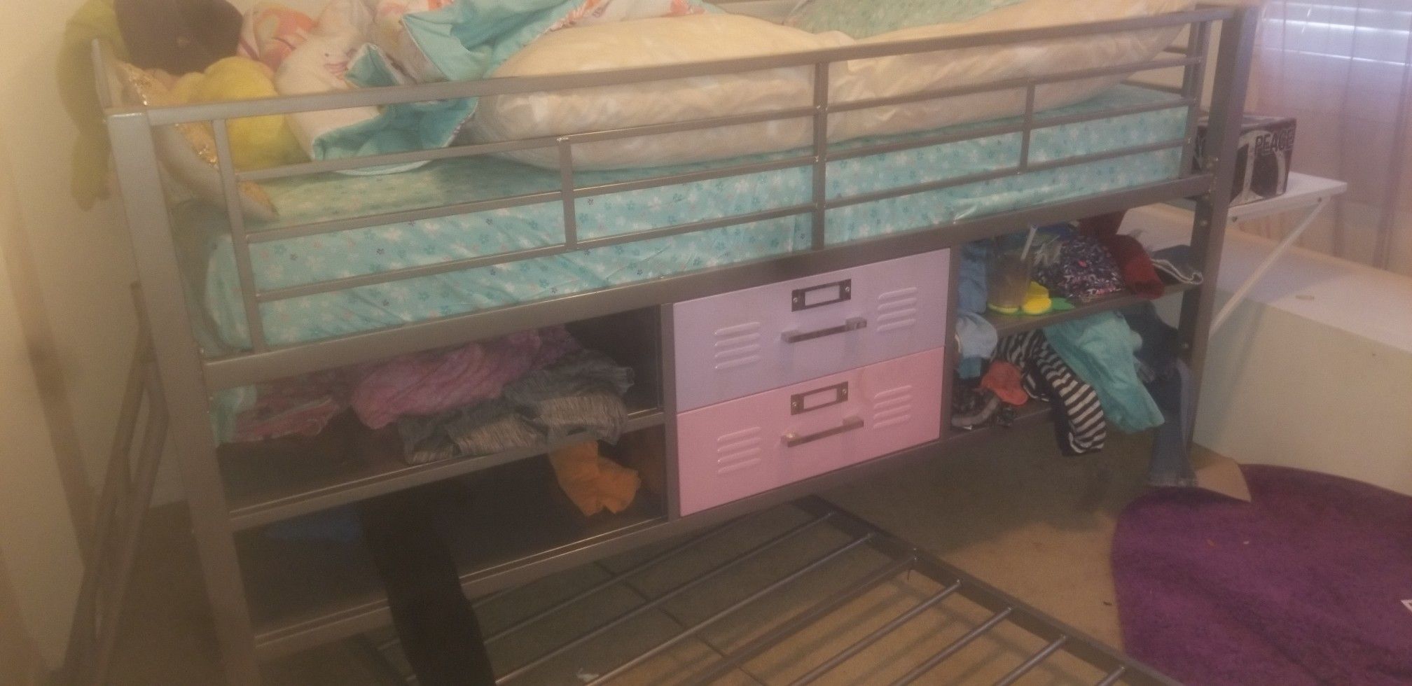 Twin loft bed frame with tons of storage and a built in desk