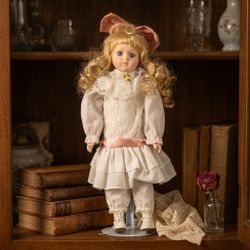 Vintage Porcelain Doll with Blonde Hair and White Dress