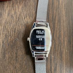 RELIC WRIST WATCH IN METAL CASE SELLING FOR 15 
