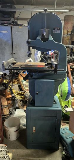 Woodworking Bandsaw 14" JWBS-14The image shows a JET JWBS-14CS 14-inch Closed Stand Bandsaw. 
Here's some information about this bandsaw:
Features:
It