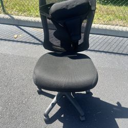 Made for  and sold by Staples. The armless adjustable multi function ergonomic office chair is in good condition and fully functional. Location below 
