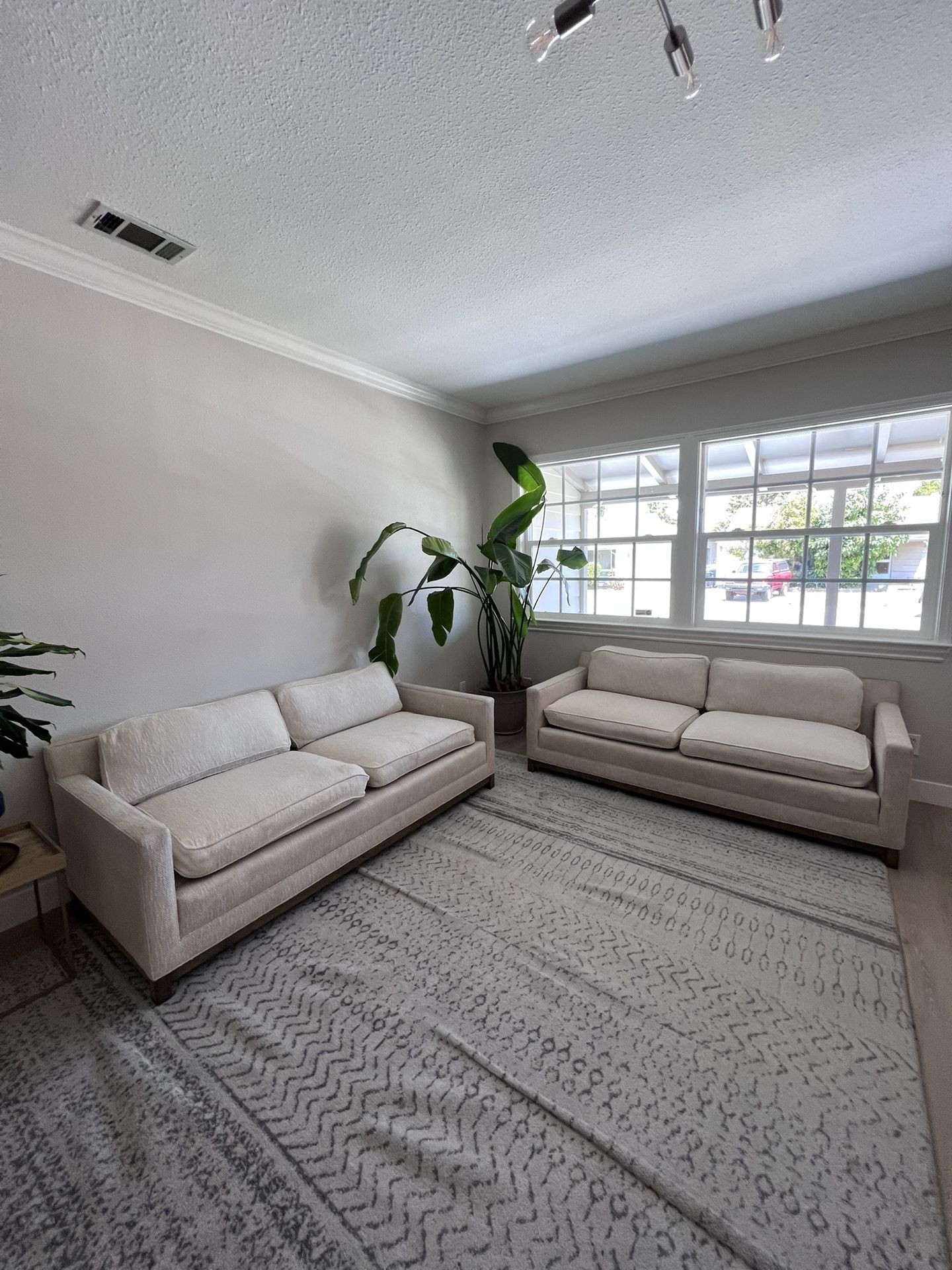 Two Beige Loveseat Sofa Couches