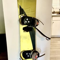 Snowboard With Helmet and Goggles