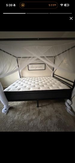 Black canopy queen size bed