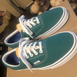 Vans Era sneakers in a teal blue/green canvas color