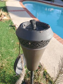 4 Used Metal Tiki Torches