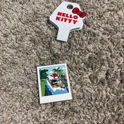 Hello Kitty Jurassic World keychain (from Universal Studios)