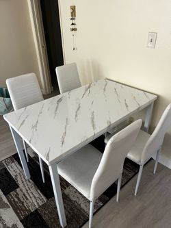 White dining table for 4