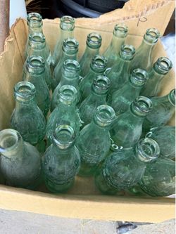 24 old coke bottles