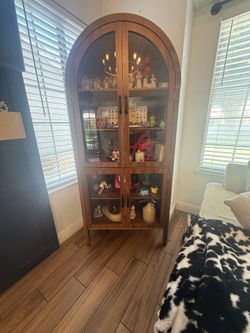 Arched display cabinet.