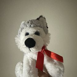 Husky Stuffed Animal With A Red Bow