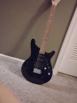 Rogue dark purple guitar