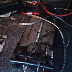 2 -12" Kicker White Comp Subwoofers Alongside With A Power acoustic 2500 Watt Amp