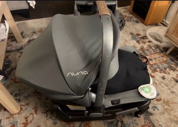 Nuna car seat with adapter plate.