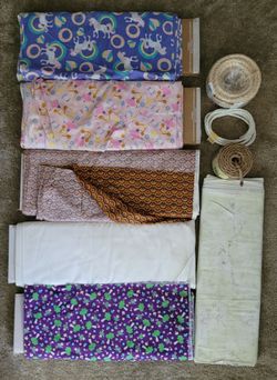 6 bolts of fabric - lot of yards! Varied patterns