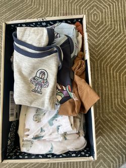Box of baby boy clothes