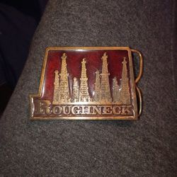 Old Oilfield Belt Buckle.  Reads "Roughneck"