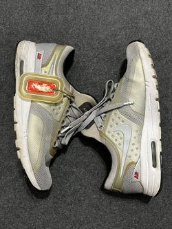 Grey and gold Nike Air Max trainers