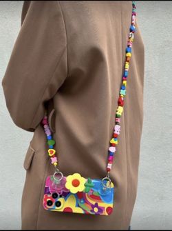 Colorful Beaded IPhone 13 Pro Max Case with Strap  Vibrant phone case with a colorful beaded strap. Features a playful design with flowers and pattern