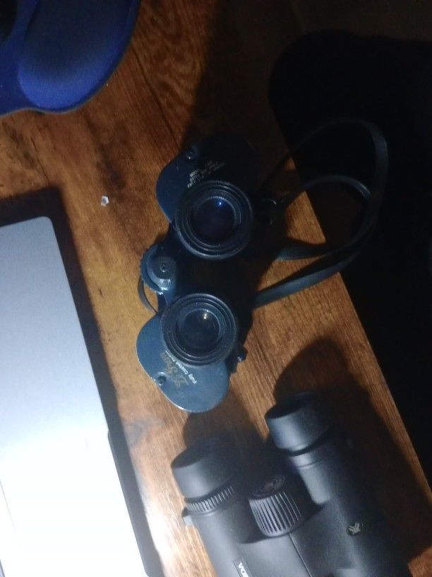 Two Sets Of Binoculars