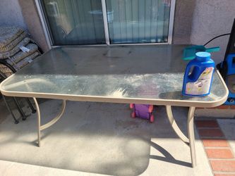 Backyard glass table and 6 chairs.
