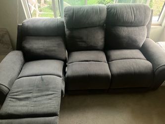 Charcoal Grey Modern Couch Reclining seats with fold-out leg supports; plush headrests and padded armrests