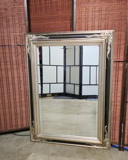 The mirror has beautifully bevelled glass.