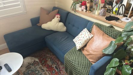 Blue Suede sectional couch with storage chaise