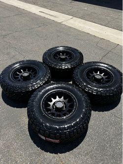 Method MR305 NV 8x6.5 17" Double Black Wheels with 35” Nitto RidgeGrappler Tires