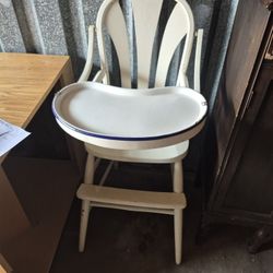 ANTIQUE HIGH CHAIR WITH THE LOCKS.