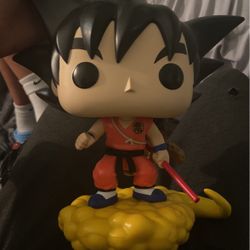A 12-16inc Son-Goku Pop Figure