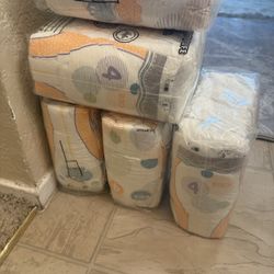 9 Packets Of Size 4 Baby Diapers