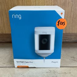 RING SPOTLIGHT CAM PLUS PLUG-IN OUTDOOR CAMERA WITH LIGHTS AND SIREN.
