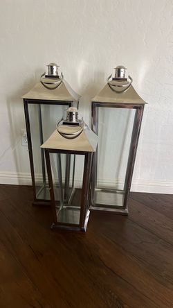 Set of three stainless steel and glass lanterns with opening doors